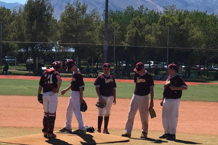 File photo Pahrump baseball players gather near the mound after a pitching change Sunday during ...