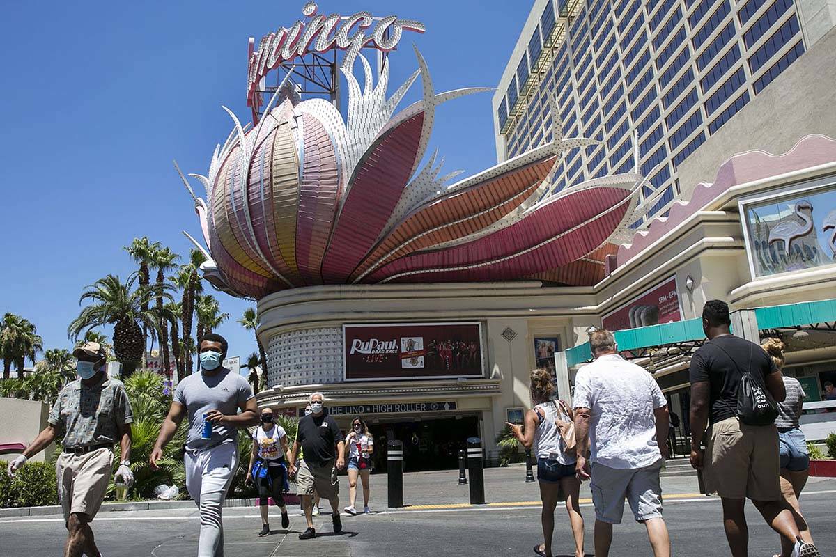 Tourists walk along Las Vegas Boulevard near the Flamingo, July 3, 2020, in Las Vegas. (Bizuaye ...