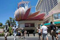 Tourists walk along Las Vegas Boulevard near the Flamingo, July 3, 2020, in Las Vegas. (Bizuaye ...