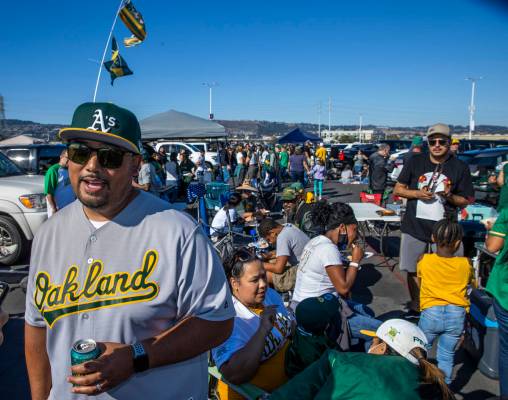 Oakland A‘s fan Chris Crisolo enjoy a tailgate with family and friends in the parking lot of ...