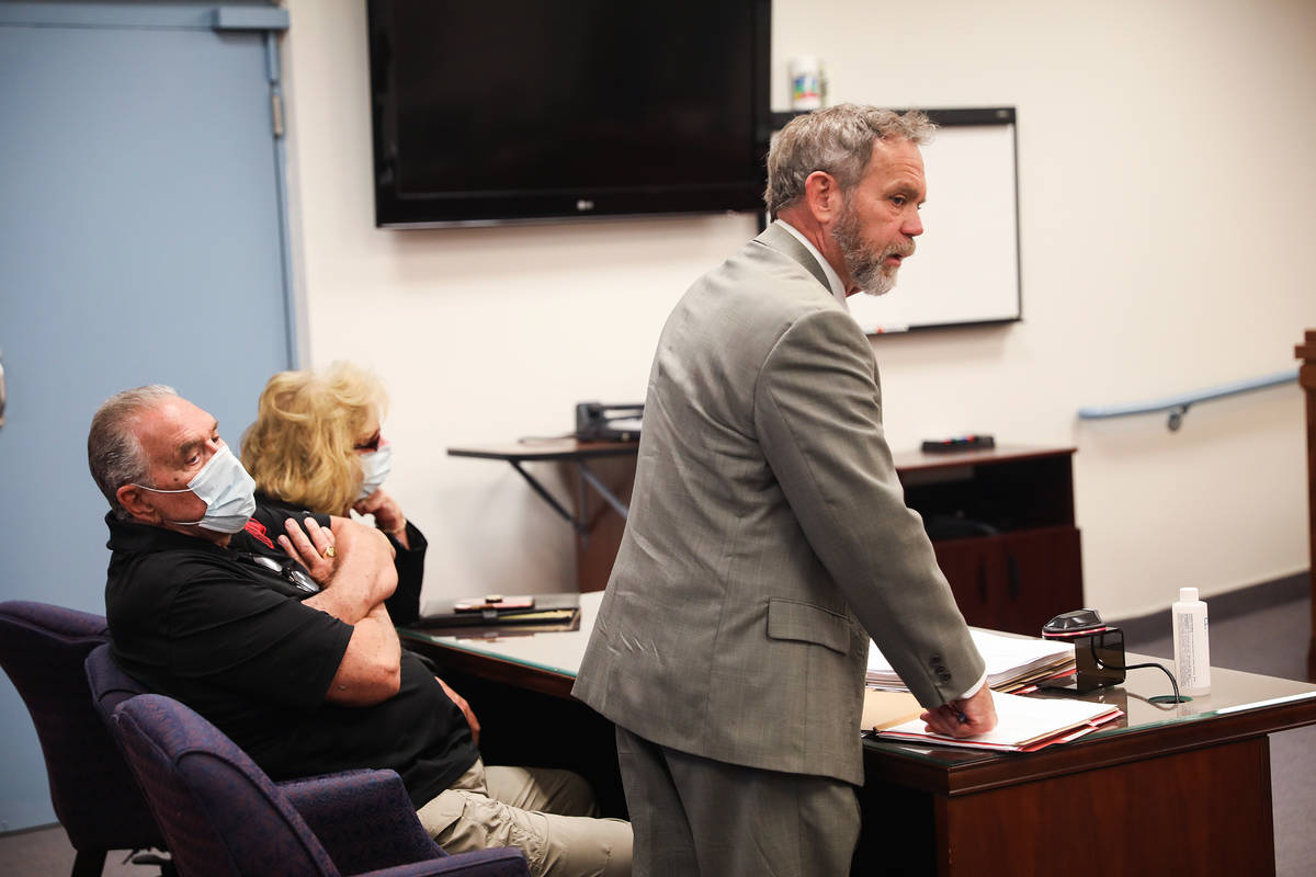 Marcel Chappuis sits with his wife Patricia Chappuis as their defense attorney Thomas Gibson sp ...