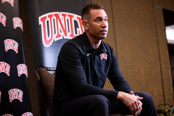 UNLV football coach Marcus Arroyo responds to questions during Mountain West Conference media d ...