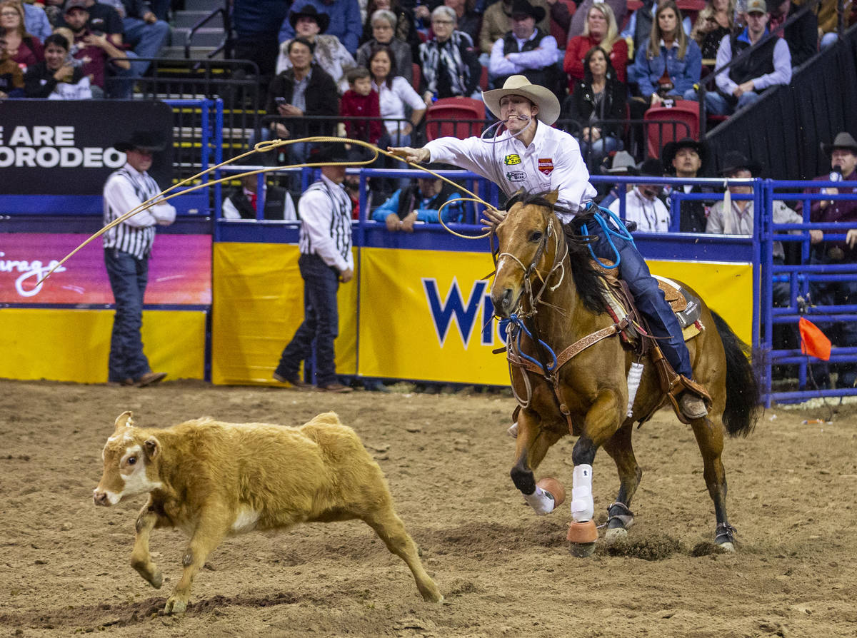Taylor Santos of Creston, Calif., tosses his lasso in tie-down roping at the tenth go-round of ...