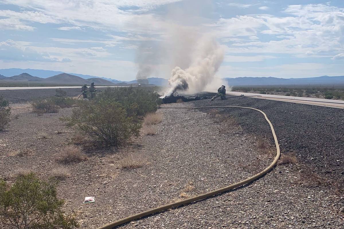 Nye County officials respond to a "downed aircraft" on U.S. Highway 95 on Wednesday, July 28, 2 ...