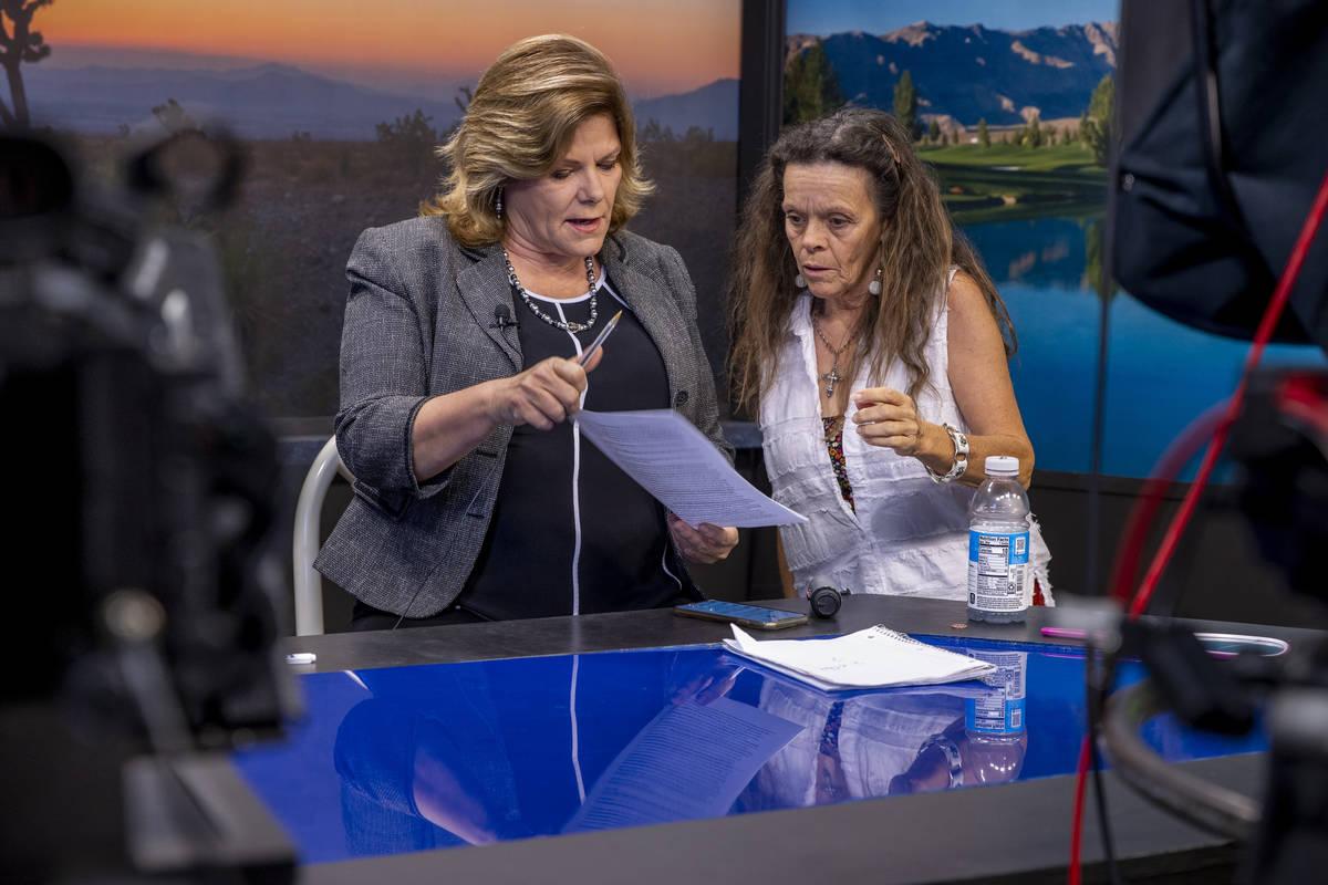 KPVM 25 News Director/Anchor Deanna O'Donnell, left, talk about some edits to her script with N ...