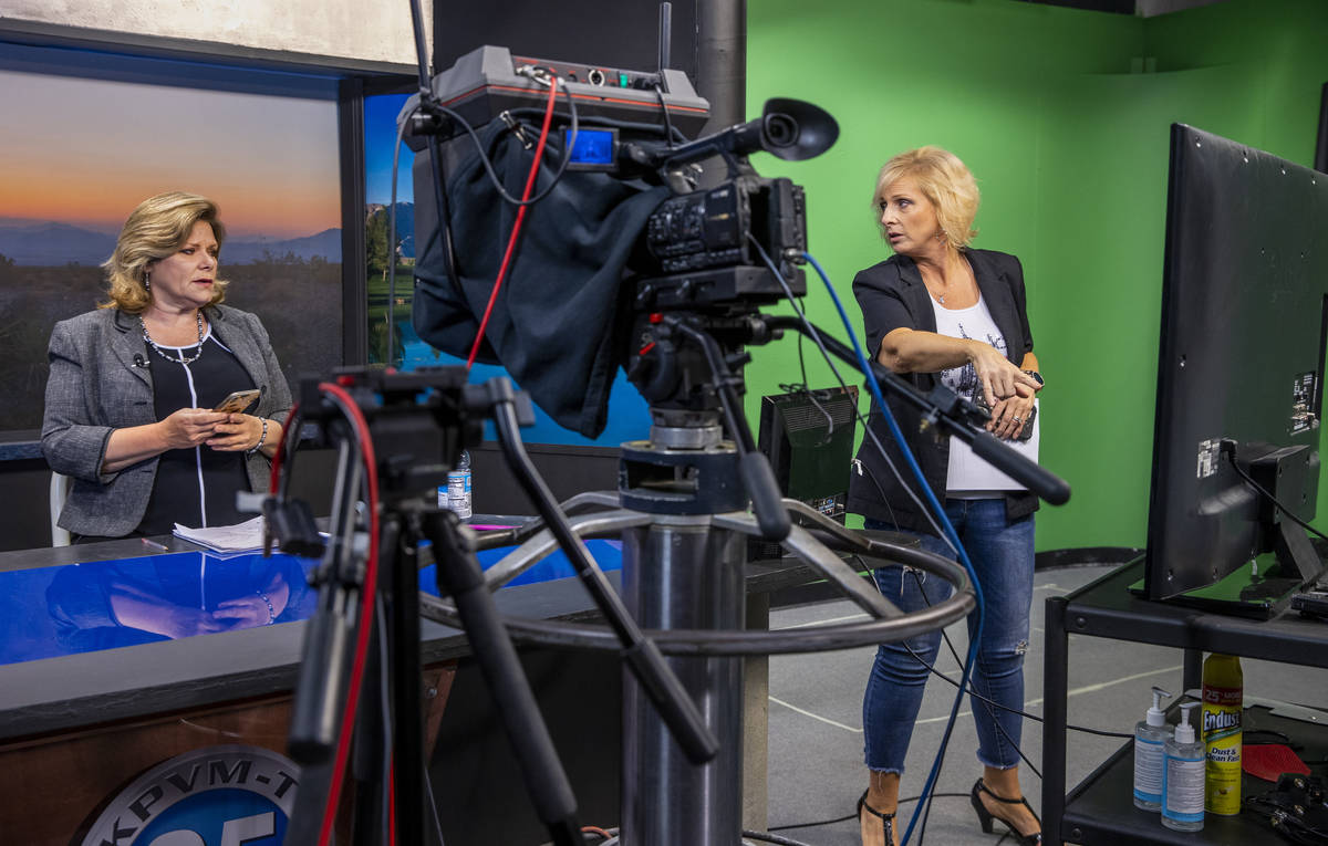 KPVM 25 news director/anchor Deanna O'Donnell, left, confers with Owner/Vice President Ronda Va ...