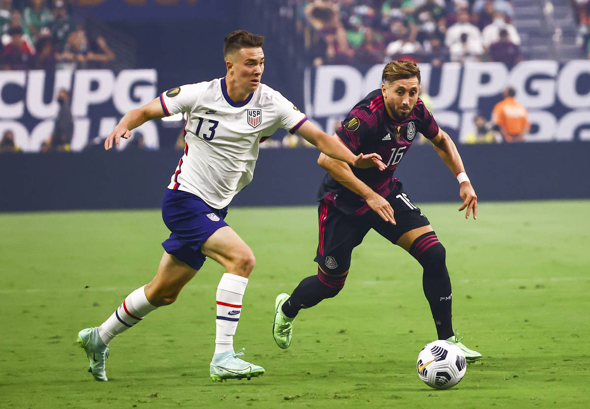 United States forward Matthew Hoppe (13) battles for possession of the ball against Mexico midf ...