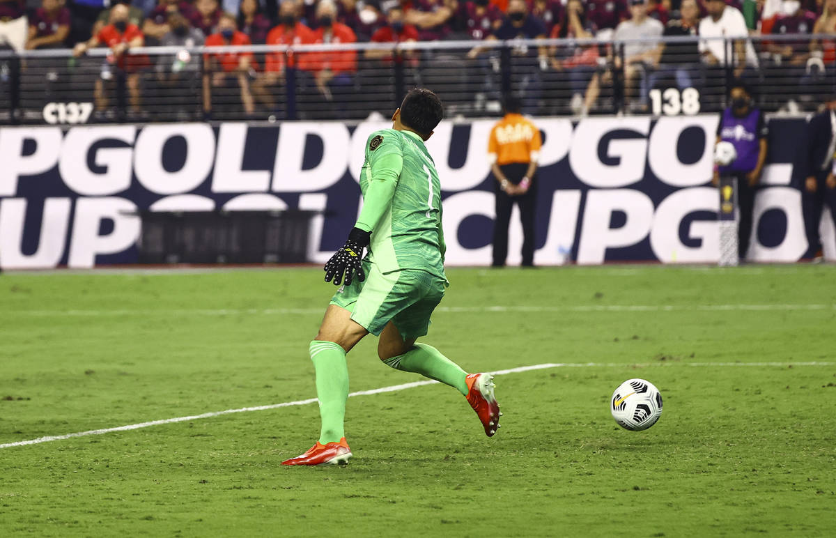 United States defender Miles Robinson, not pictured, gets the ball past Mexico goalkeeper Alfre ...