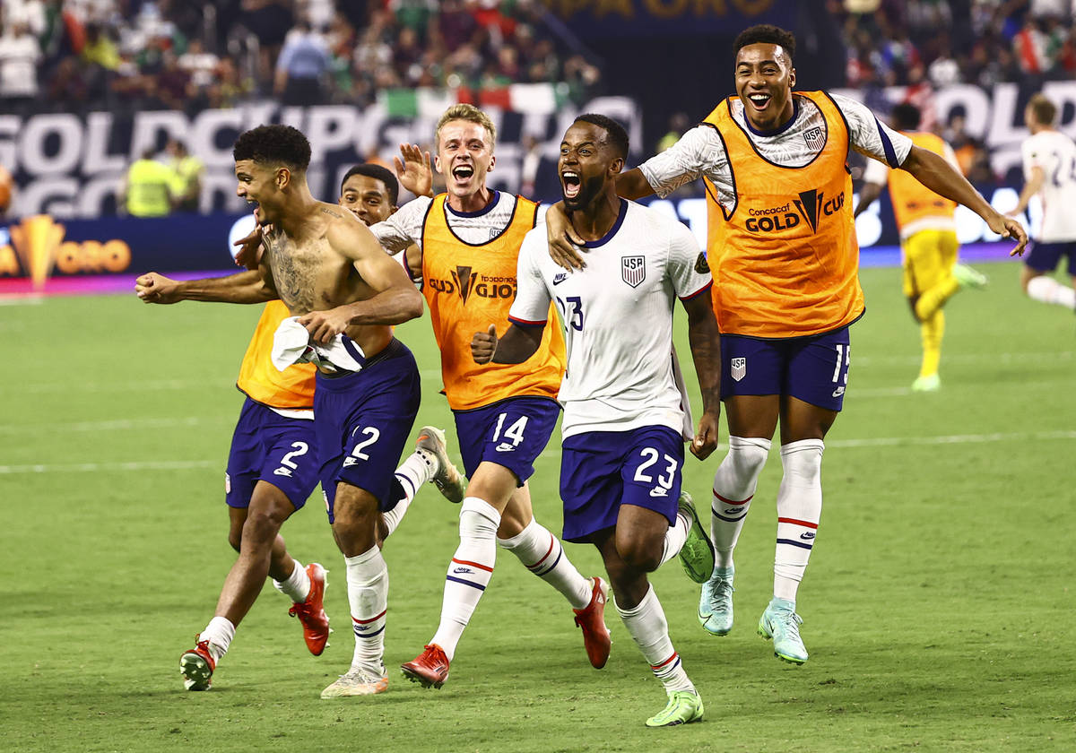 United States players celebrate after defeating Mexico 1-0 in extra time to win the Concacaf Go ...