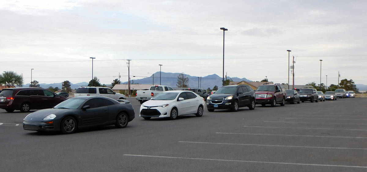 Robin Hebrock/Pahrump Valley Times The line of vehicles at the Back to School Fair was quite lo ...