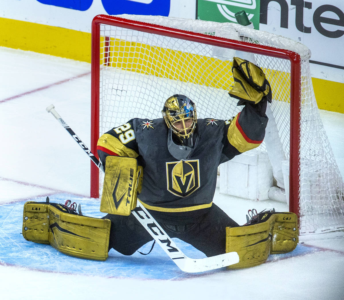 Golden Knights goaltender Marc-Andre Fleury (29) reaches up for another stop versus the Minneso ...