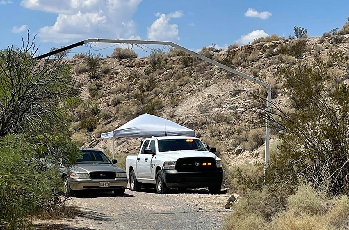 Detectives with the Nye County Sheriff’s Office investigate a homicide Sunday, Aug. 1, 2021, ...