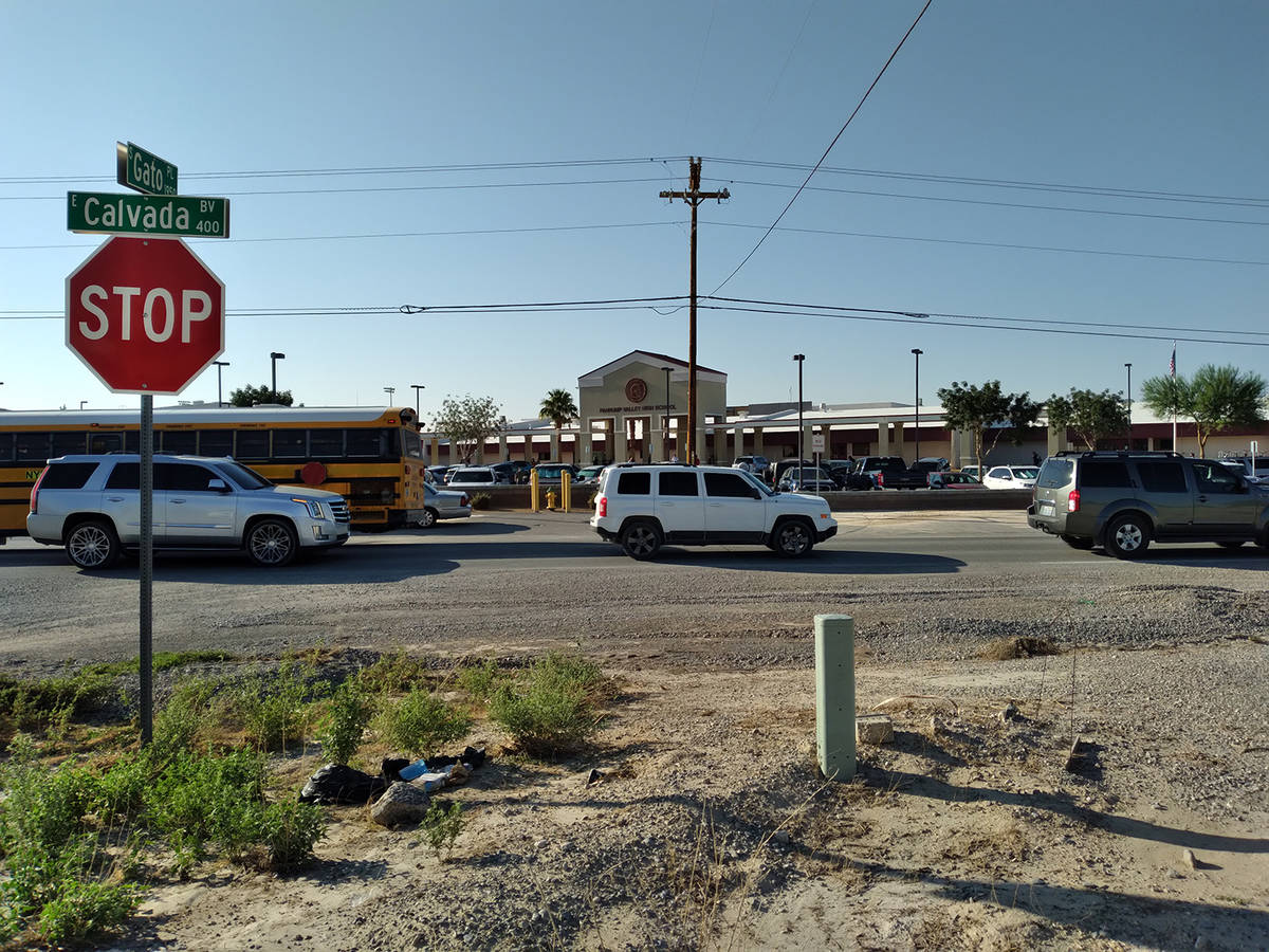 Selwyn Harris/Pahrump Valley Times Private vehicles and school buses arrive at Pahrump Valley H ...