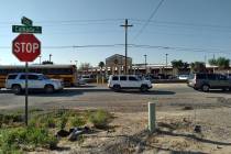 Selwyn Harris/Pahrump Valley Times Private vehicles and school buses arrive at Pahrump Valley H ...