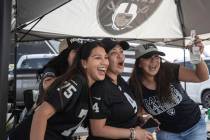 Raiders fans Isabella Luna, left, Carmen Tellez and Lisette Dominguez tailgate outside Allegian ...