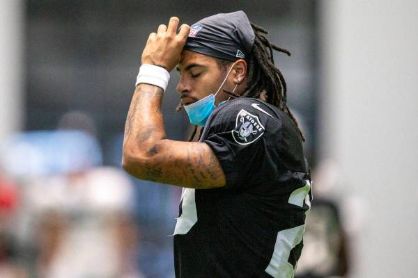 Raiders safety Trevon Moehrig (25) adjusts his head wrap during their NFL training camp practic ...