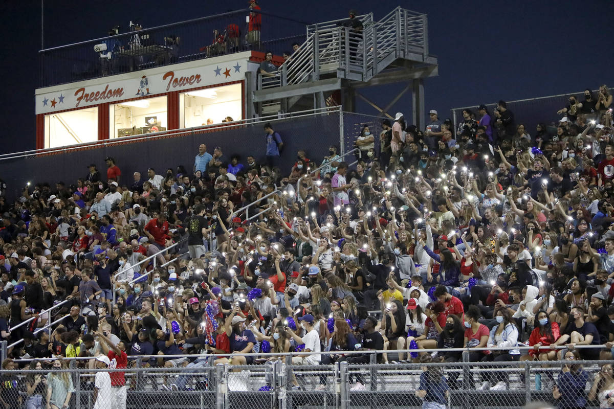 Liberty High School fans cheer during the first half of a football game against Arbor View High ...