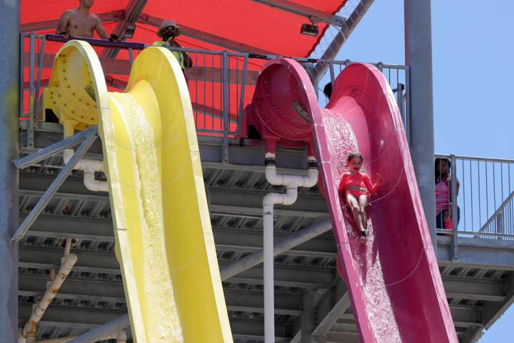 Georgia Scarlett, 6, of Las Vegas rides on Canyon Cliffs on opening day at Wet 'n' Wild water p ...