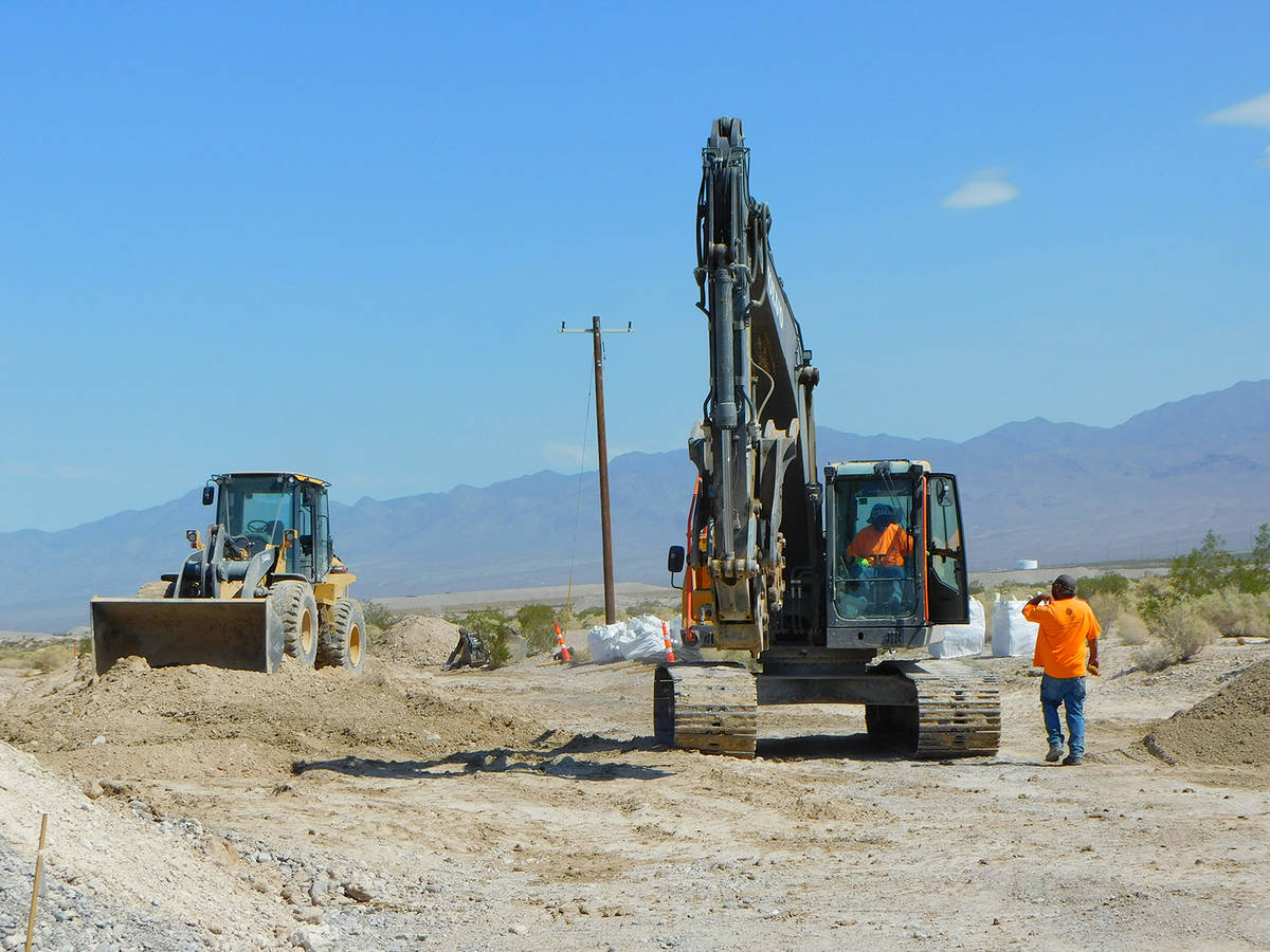 Robin Hebrock/Pahrump Valley Times Crews are seen working tractors at the site of the new anima ...