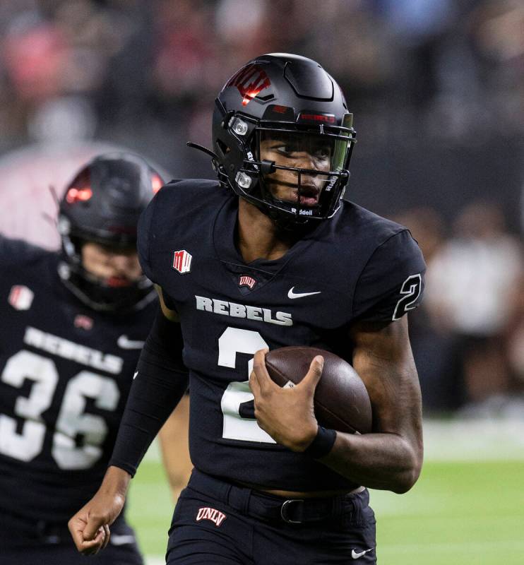 UNLV Rebels quarterback Doug Brumfield (2) goes for a touchdown during the fourth quarter of an ...