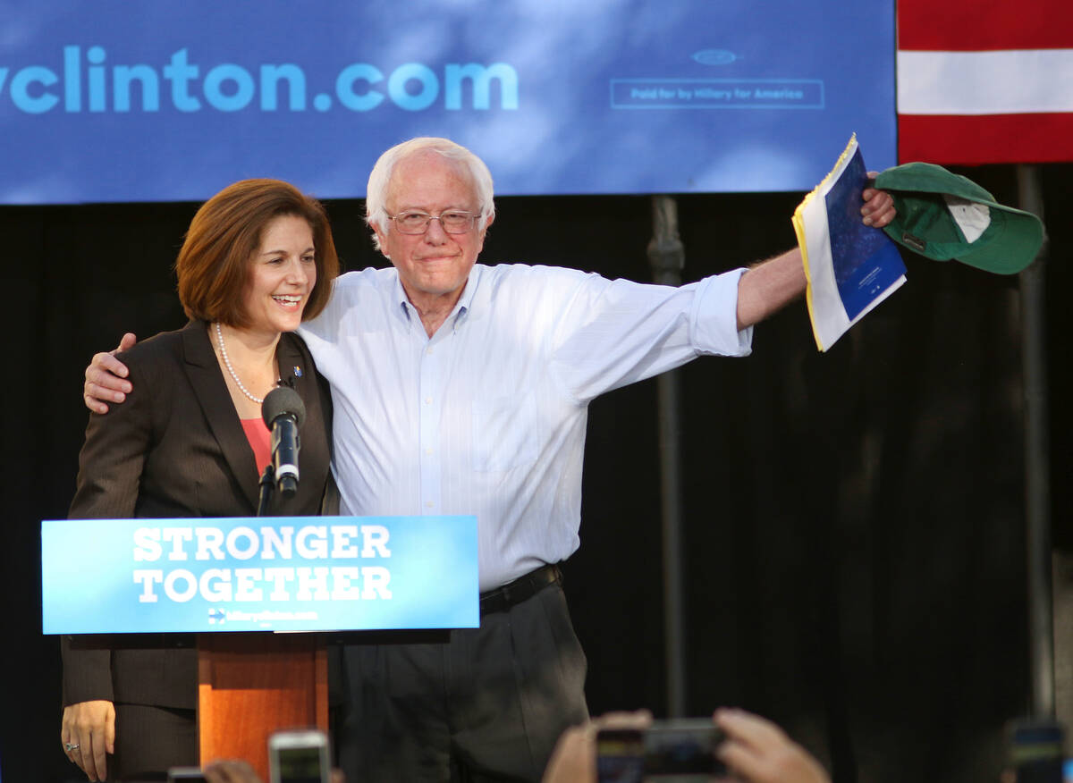 Vermont Sen. Bernie Sanders, right, embraces Nevada U.S. Senate Democratic candidate Catherine ...