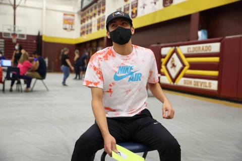 Ethan Lucero, 19, of Las Vegas, waits in observation after receiving the COVID-19 vaccine durin ...