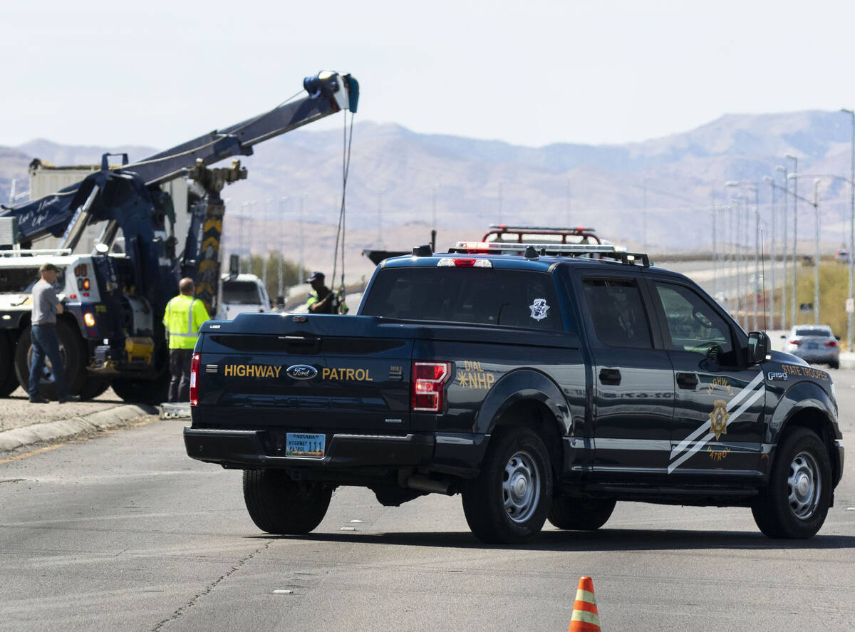 The Nevada Highway Patrol investigates a rollover crash on Blue Diamond Road and Edmond Street, ...