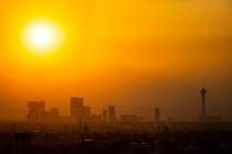 The sun shines through smoke and haze over the north end of the Las Vegas Strip in Las Vegas on ...