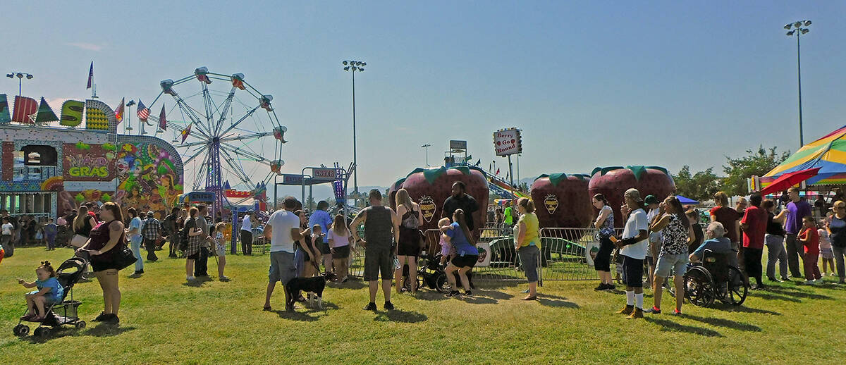 Robin Hebrock/Pahrump Valley Times Families can be seen filling the carnival area at Petrack Pa ...