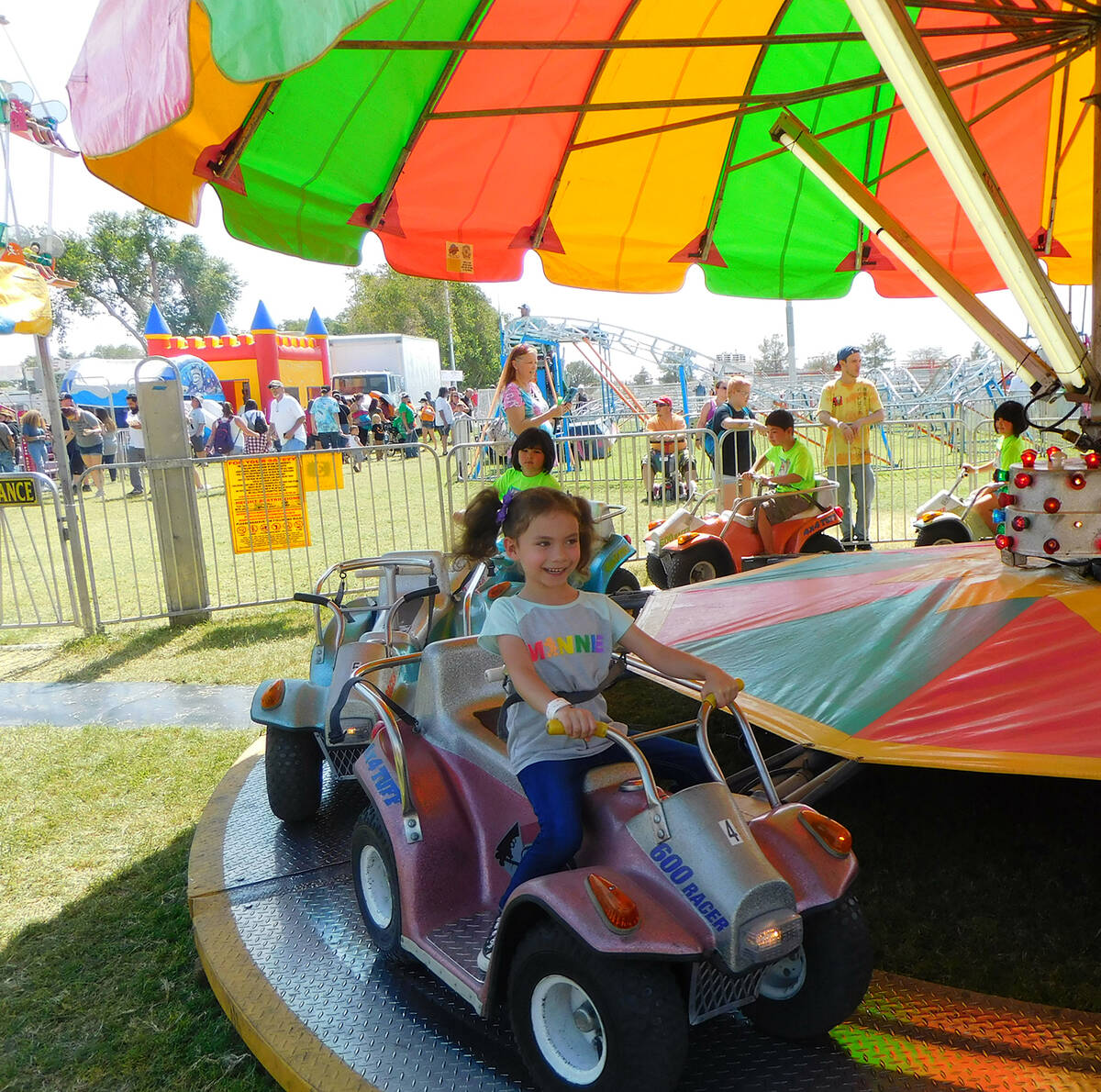 Robin Hebrock/Pahrump Valley Times With a bright smile on her face, a young Fall Festival atten ...