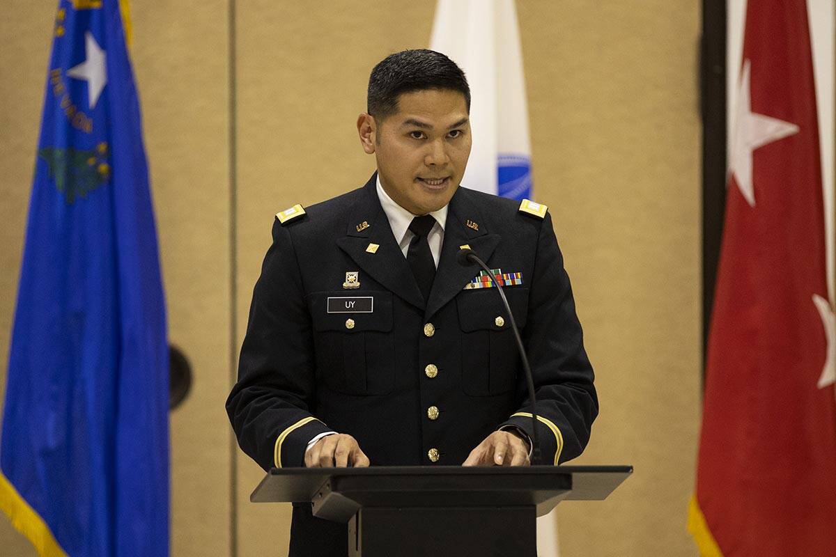 Army National Guard Capt. Gabriel Uy reads a letter on behalf of President Joe Biden during a c ...