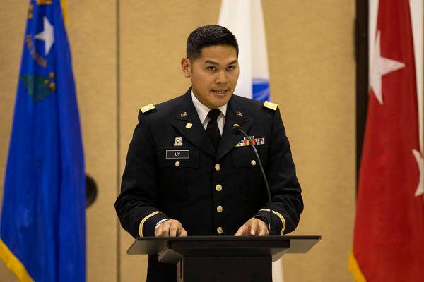 Army National Guard Capt. Gabriel Uy reads a letter on behalf of President Joe Biden during a c ...