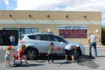 Robin Hebrock/Pahrump Valley Times Volunteers at the Halloween Costumes for Kids Car Wash Donat ...