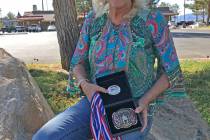 Robin Hebrock/Pahrump Valley Times Debra Strickland is pictured posing with her SASS Nevada Sta ...