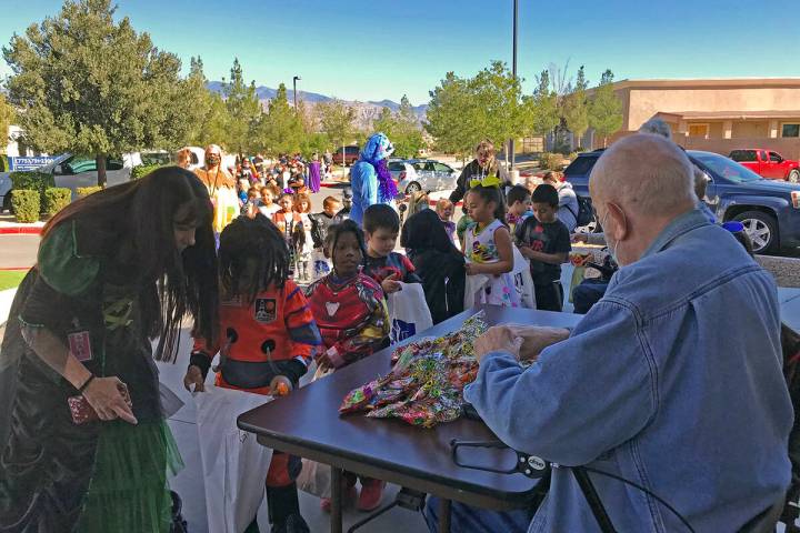 Robin Hebrock/Pahrump Valley Times Residents at Inspirations Senior Living are pictured handing ...