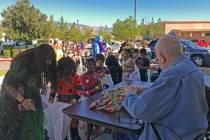 Robin Hebrock/Pahrump Valley Times Residents at Inspirations Senior Living are pictured handing ...