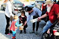 Randy Gulley/Pahrump Moose Lodge Members of the Pahrump Moose Lodge #808 offer candy to childre ...
