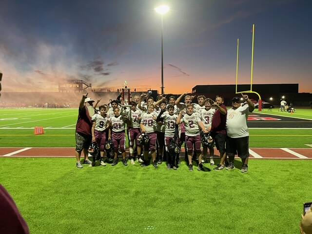 Tina Wilson/Special to the Pahrump Valley Times. Pahrump's U13 football team posing with the tr ...