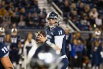 Nevada quarterback Carson Strong (12) looks to throw against UNLV in the first half of an NCAA ...
