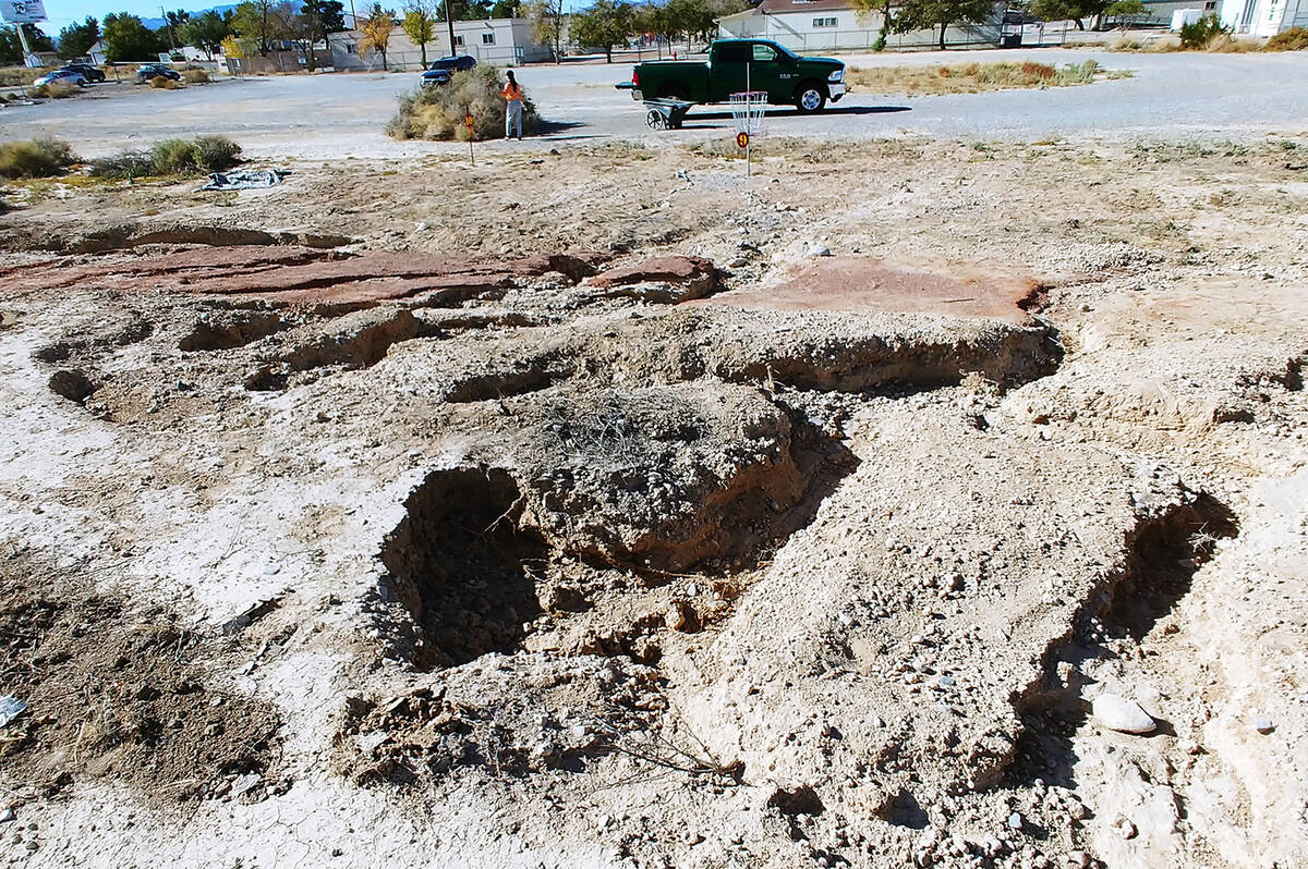 Special to the Pahrump Valley Times July's historic rain and flooding created deep erosion and ...