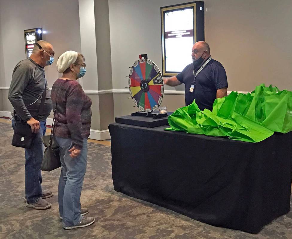 Robin Hebrock/Pahrump Valley Times Dean Taylor is pictured spinning the wheel for two guests wh ...