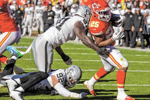 Kansas City Chiefs running back Clyde Edwards-Helaire (25) steps over the goal line as Raiders ...