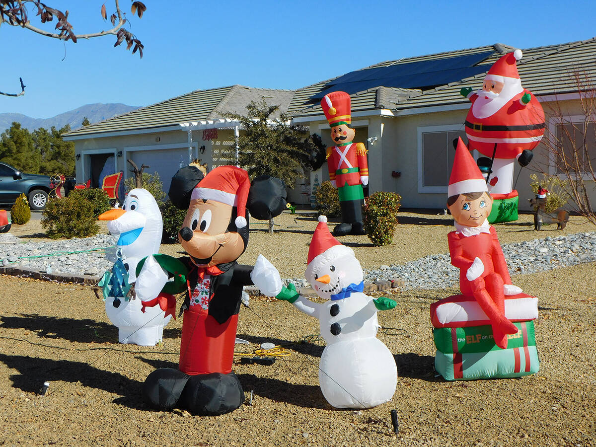 Robin Hebrock/Pahrump Valley Times Christmas inflatables of all kinds are positioned around the ...