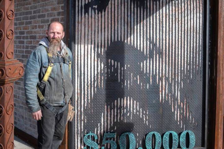 Richard Stephens/Special to the Pahrump Valley Times Artist James Henninger poses with his self ...