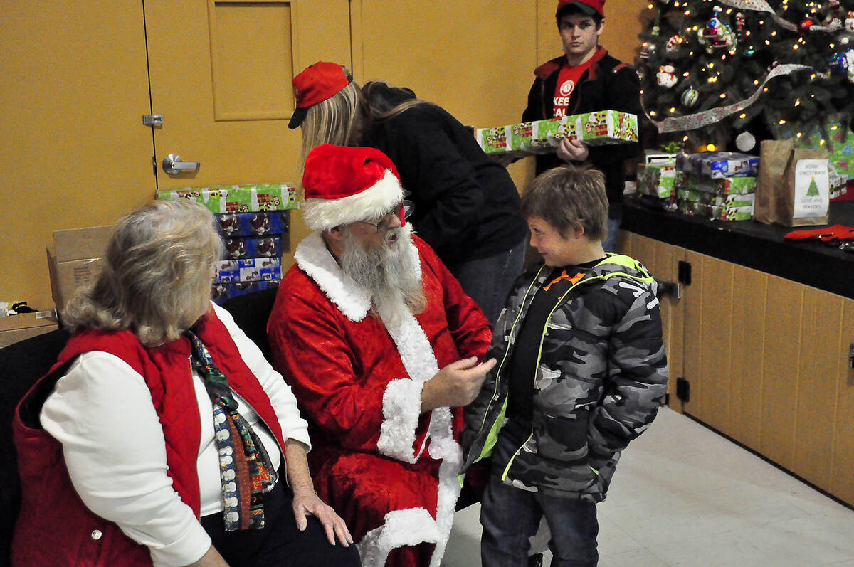 Horace Langford Jr./Pahrump Valley Times This file photo shows Santa interacting with a youn ...