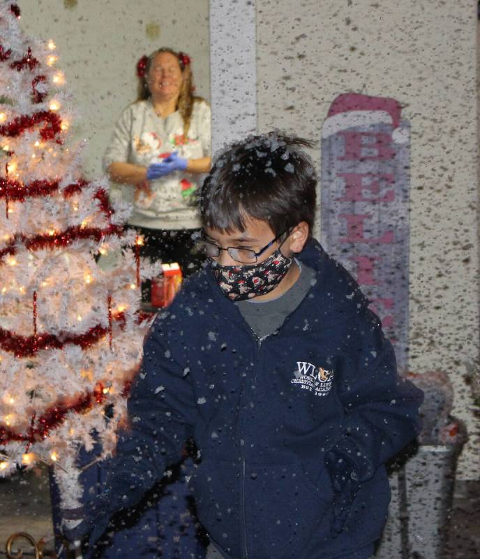 Robin Hebrock/Pahrump Valley Times Foamy bits of fluffy "snow" float through the air around one ...