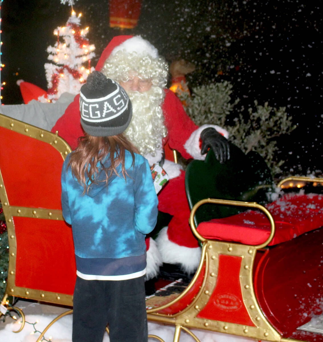 Robin Hebrock/Pahrump Valley Times Santa Claus is pictured speaking with a youngster at Christm ...