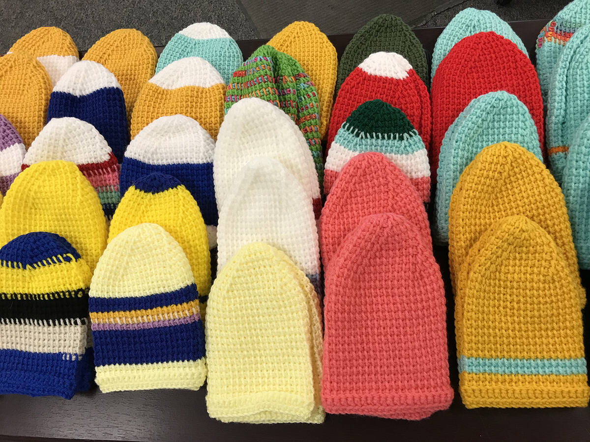 Robin Hebrock/Pahrump Valley Times Hand knitted hats were available in the coat room at the Com ...