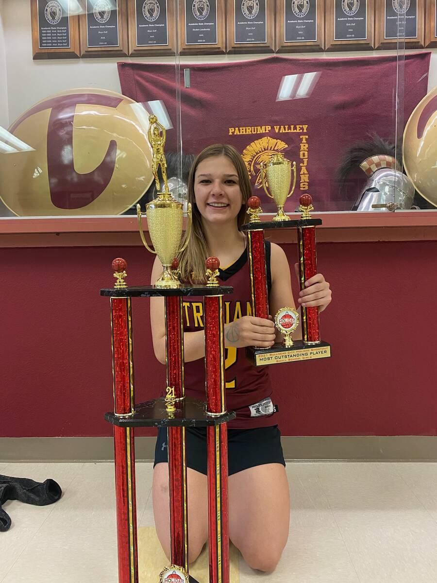 Pahrump Valley guard Tayla Wombaker with the Bullhead City (Ariz.) Shootout championship trophy ...
