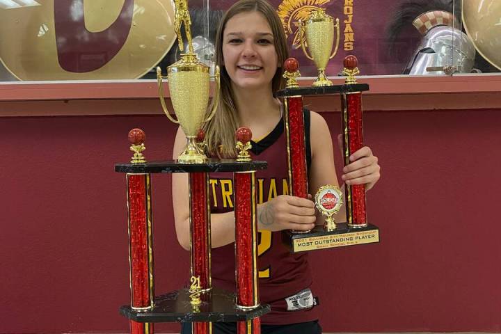 Pahrump Valley guard Tayla Wombaker with the Bullhead City (Ariz.) Shootout championship trophy ...